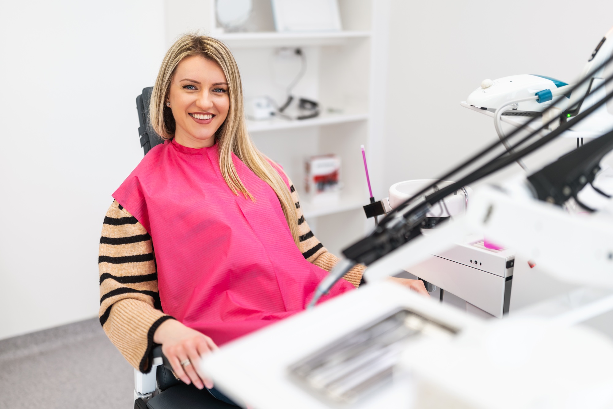 Woman smiling during a dental exam at Birk Dental in Creve Coeur, MO