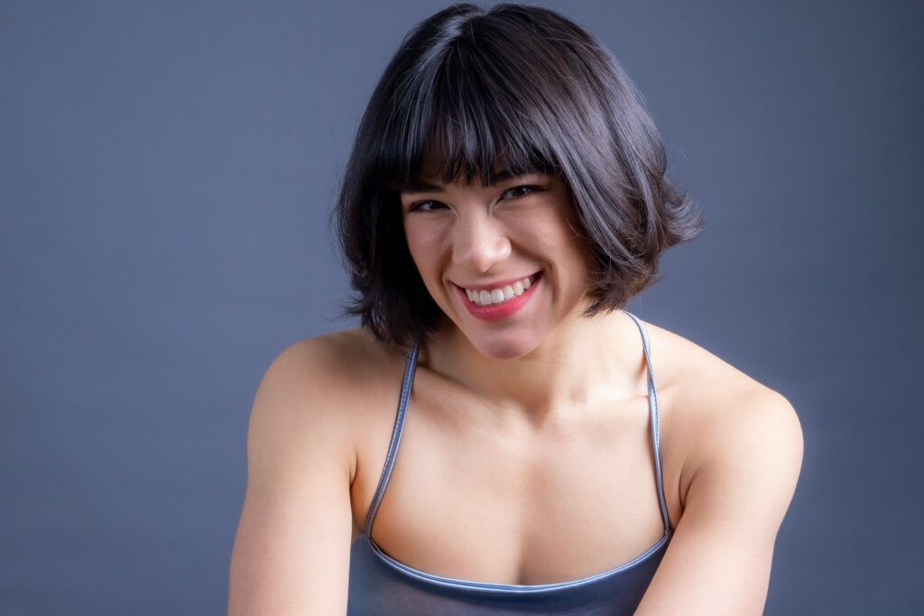 Smiling woman representing the confidence of cosmetic dentistry in Creve Coeur, MO